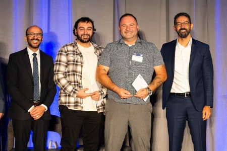 a group of men posing for a photo