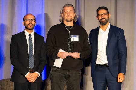 a group of men posing for a photo