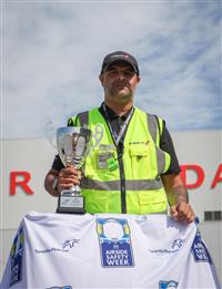 a man holding a trophy