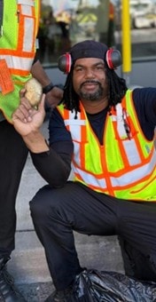 a person wearing headphones and holding a bag of chips