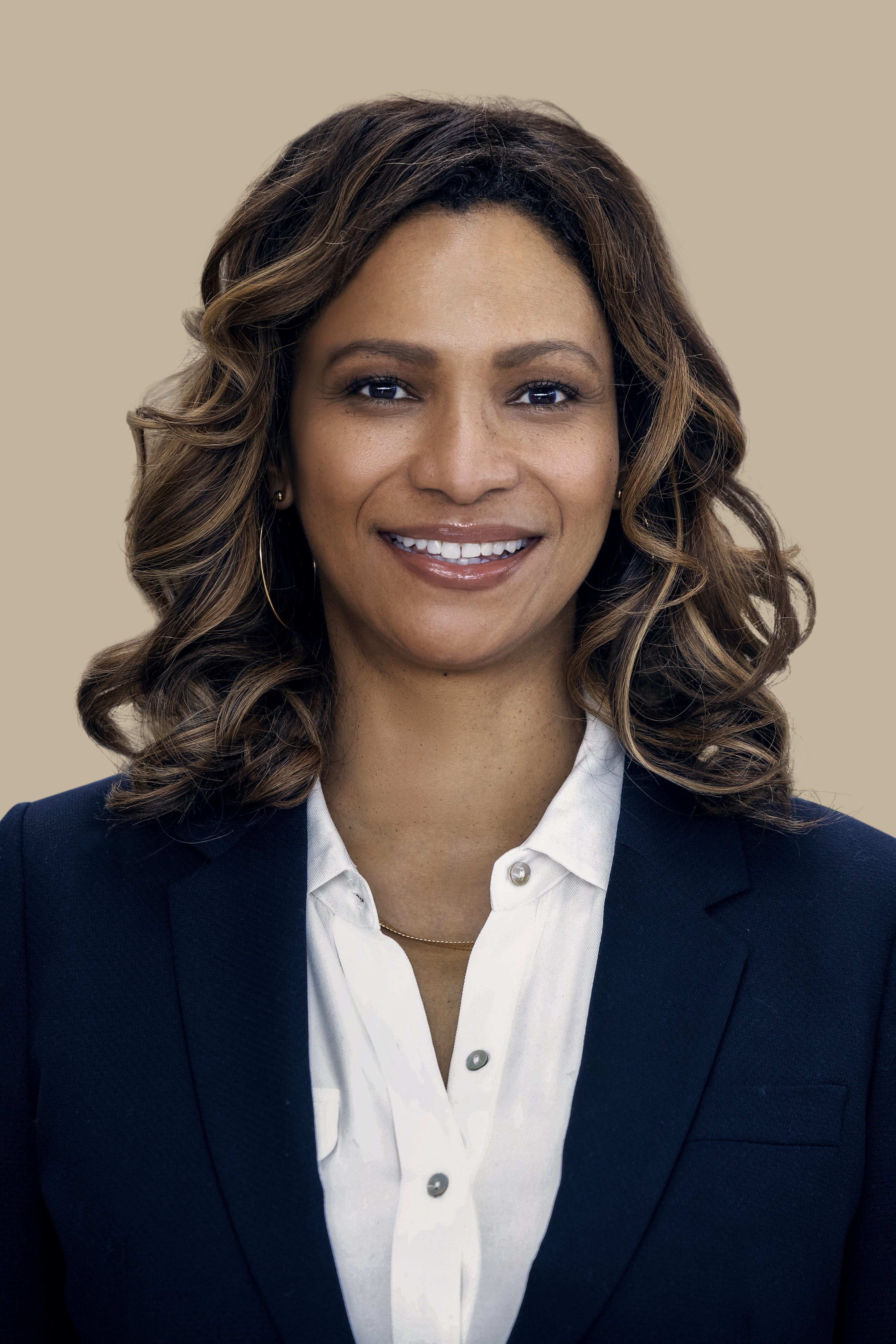 a person with long hair smiling