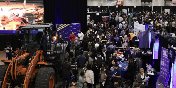 a large crowd of people at a convention