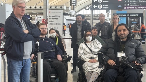 a group of people in wheelchairs