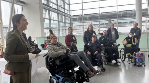 a group of people in wheelchairs