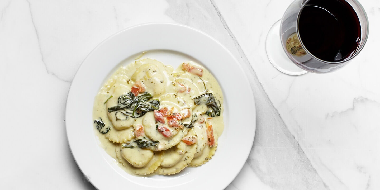 ravioli with a glass of red wine