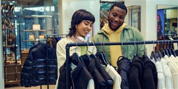 a couple of women in a clothing store