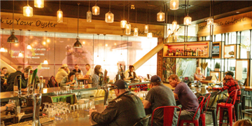 a group of people sitting at tables