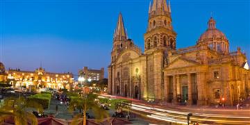 a large building with towers and a road in front of it