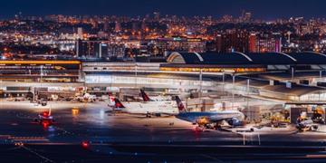 a group of airplanes on a runway