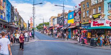 a busy street with people walking