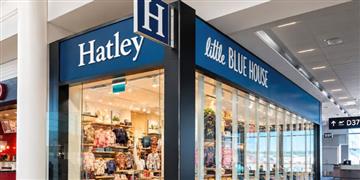 a store front with blue signs