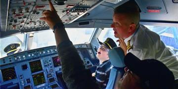 a group of people in a cockpit