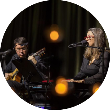 a man and woman playing instruments