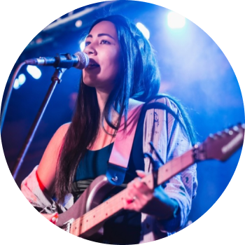 a person singing into a microphone