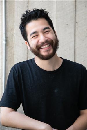 a man with his eyes closed
