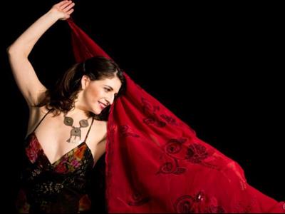 a woman holding a red umbrella
