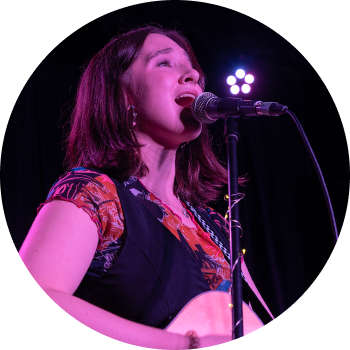 a person singing into a microphone