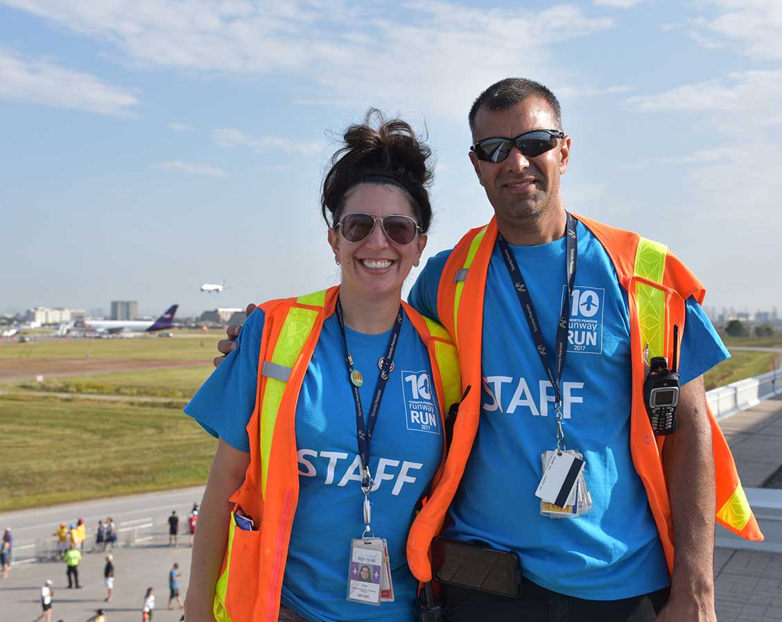 Two staff members at the Runway Run