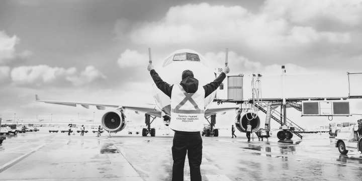 a man standing next to an airplane