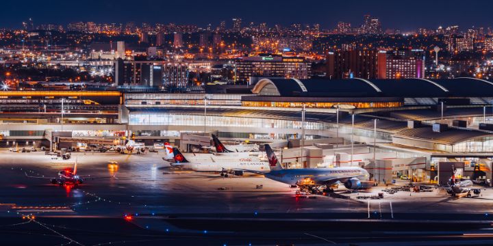 a group of airplanes on a runway