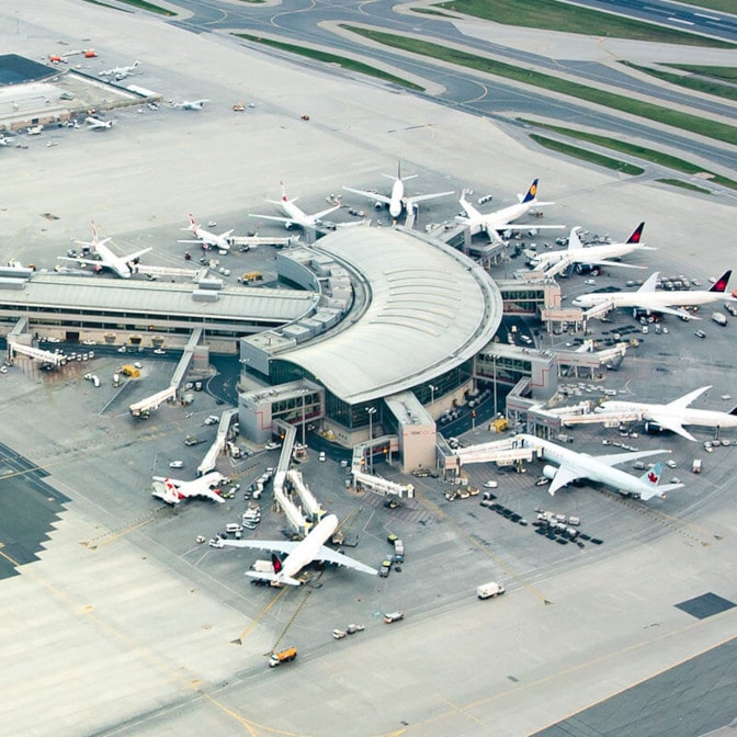 a group of airplanes at an airport