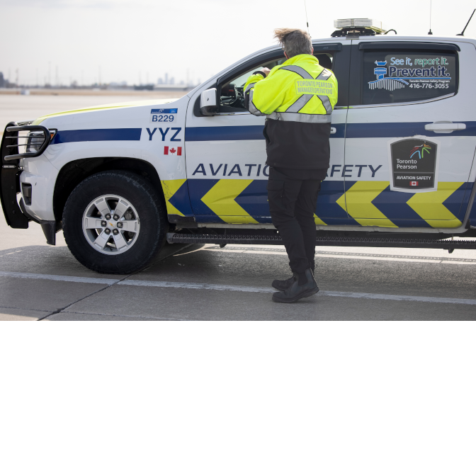 a person standing next to a police van