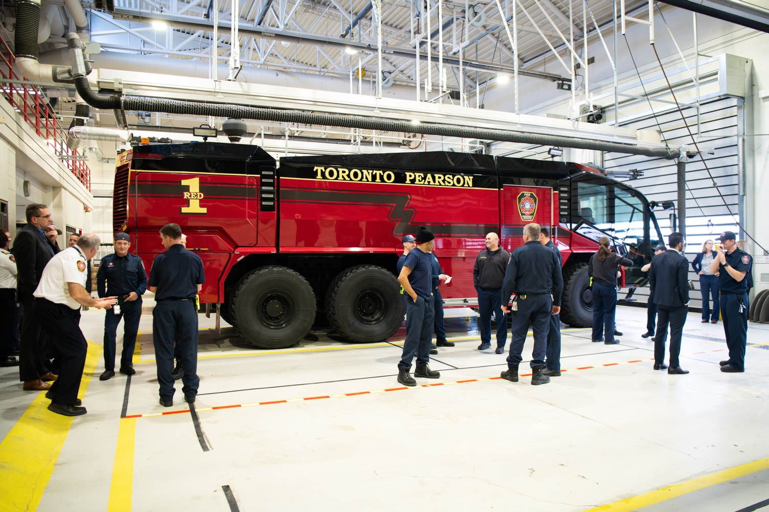 a group of people standing around a large truck
