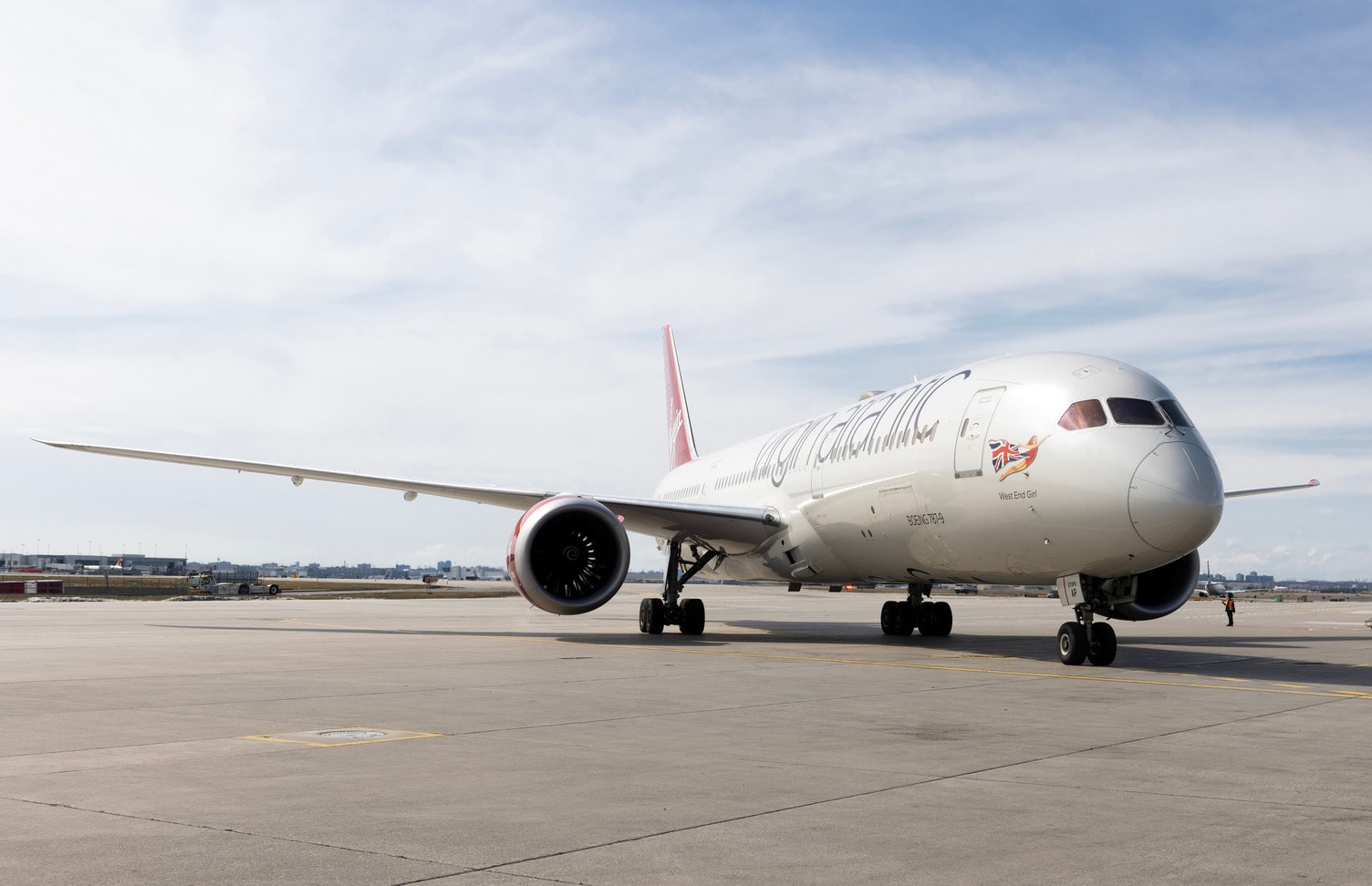 a large white airplane on a runway