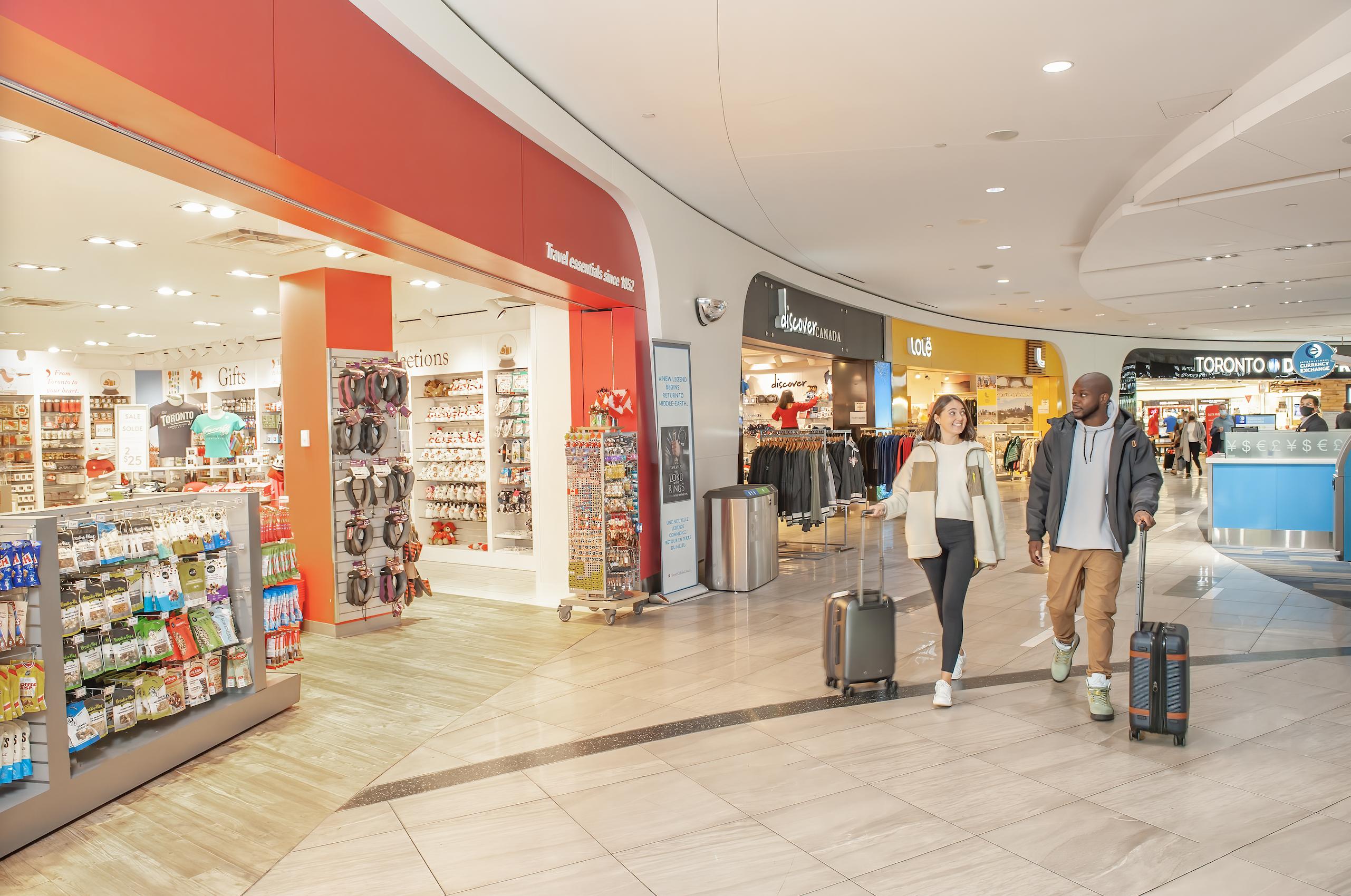 a man and a woman walking through a store
