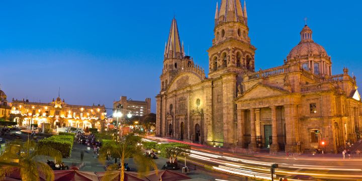 a large building with towers and a road in front of it