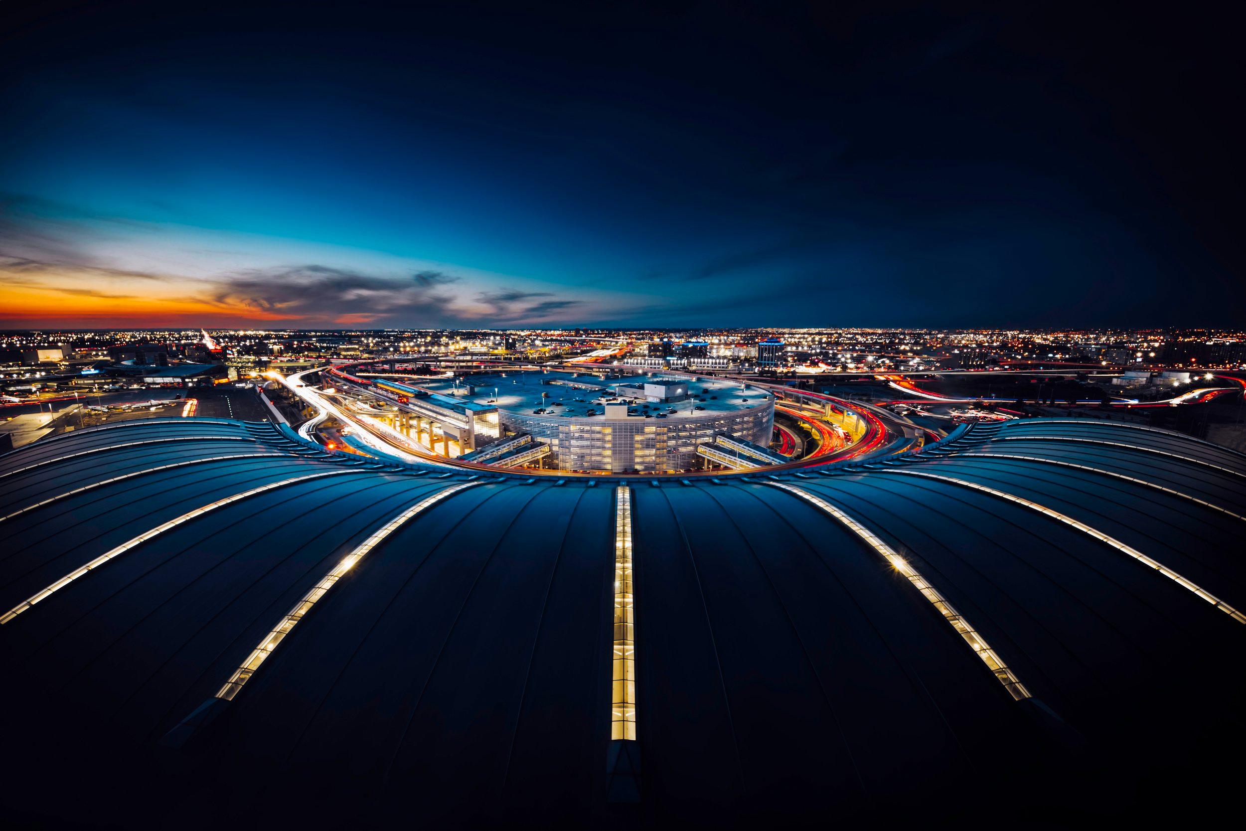 Aerial, wide-angle photo of the Toronto Pearson airport at night