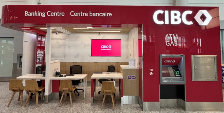 a red vending machine with a table and chairs