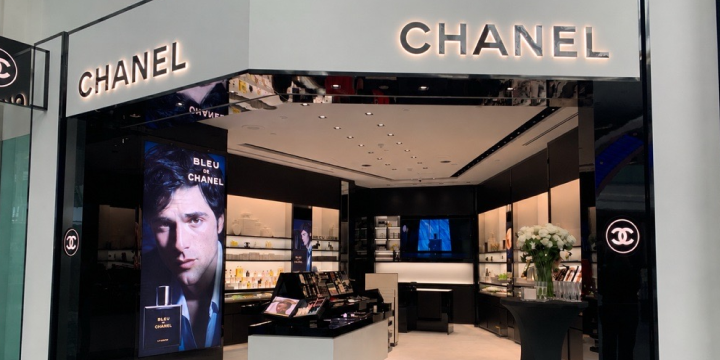 a store front with a large screen