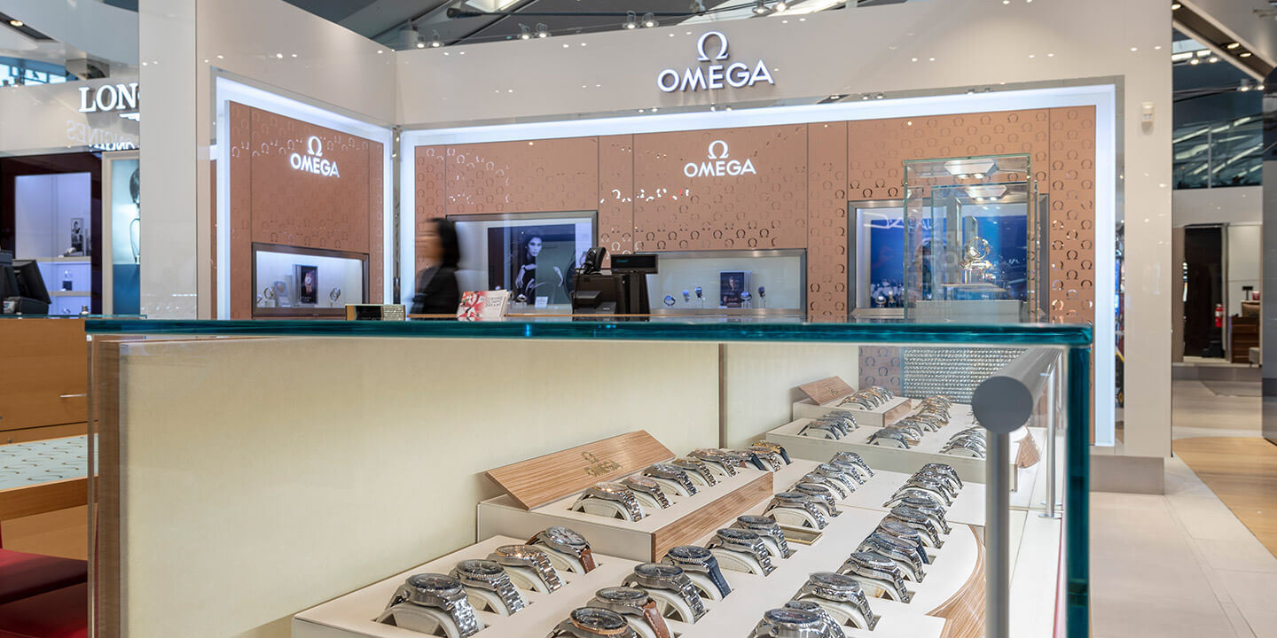View of Omega display case with an assortment of watches.