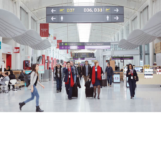 Travellers inside Toronto Pearson Airport